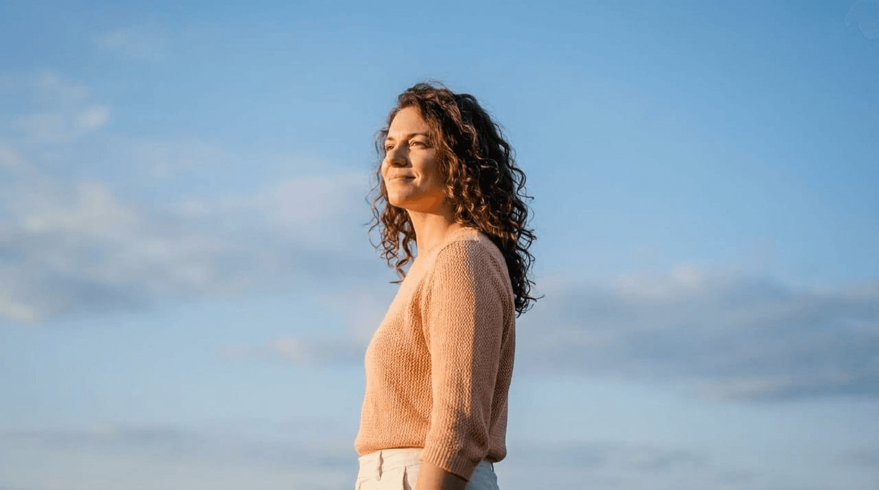 Woman looking confident in warm sunlight